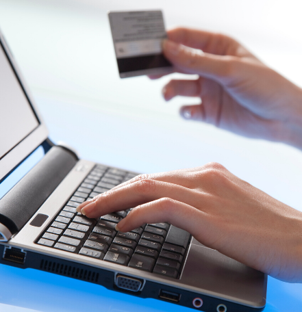 image of a laptop and credit card