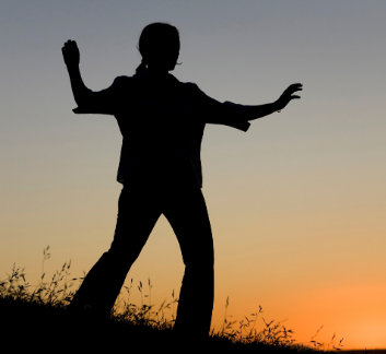 silhouette of a person doing tai chi