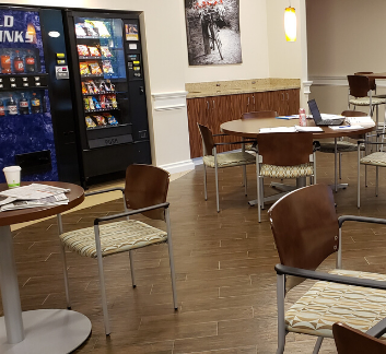photo of vending machines, tables and chairs