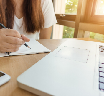 Image of a student working on a laptop