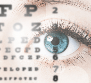 Close up of a blue eye, with the letters of an eye chart superimposed over the eye