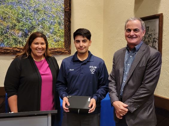 Three people grouped together, smiling at the camera